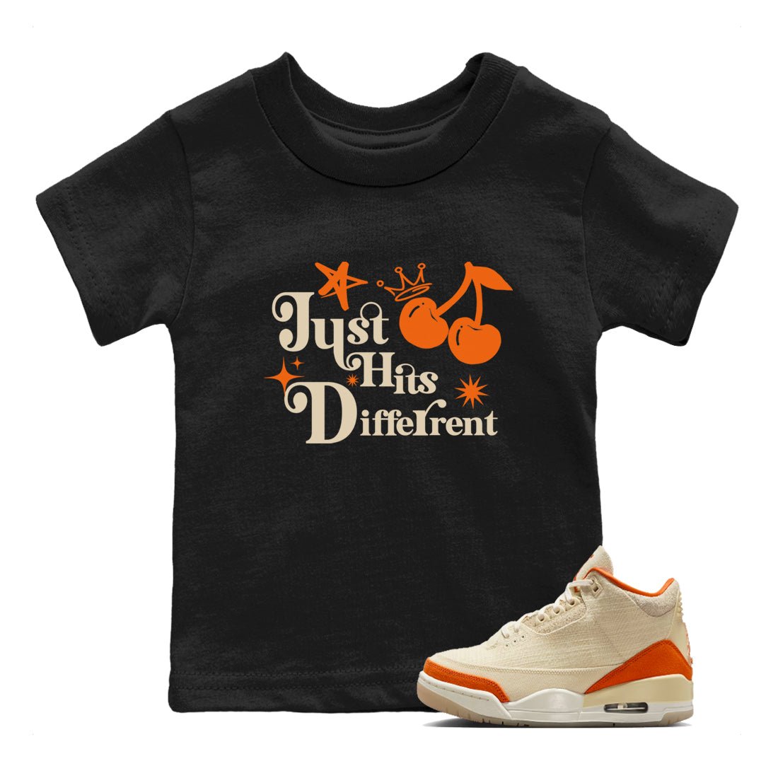 Just Hits Different baby and kids t-shirt crafted for little sneakerheads to shine with the Air Jordan 3 Starfish sneakers, displayed in Black 1.