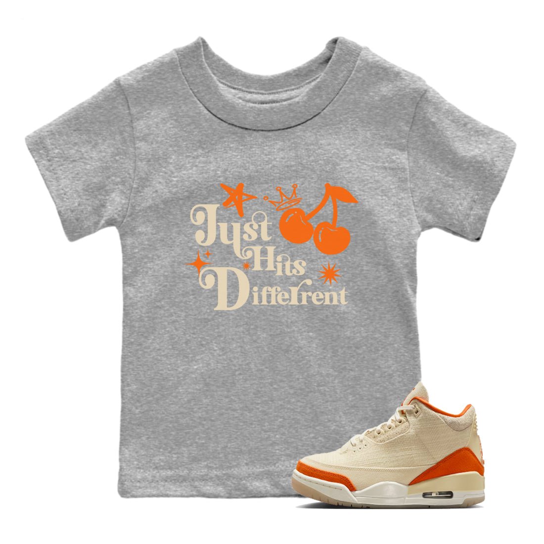 Just Hits Different baby and kids t-shirt crafted for little sneakerheads to shine with the Air Jordan 3 Starfish sneakers, displayed in Heather Grey 1.