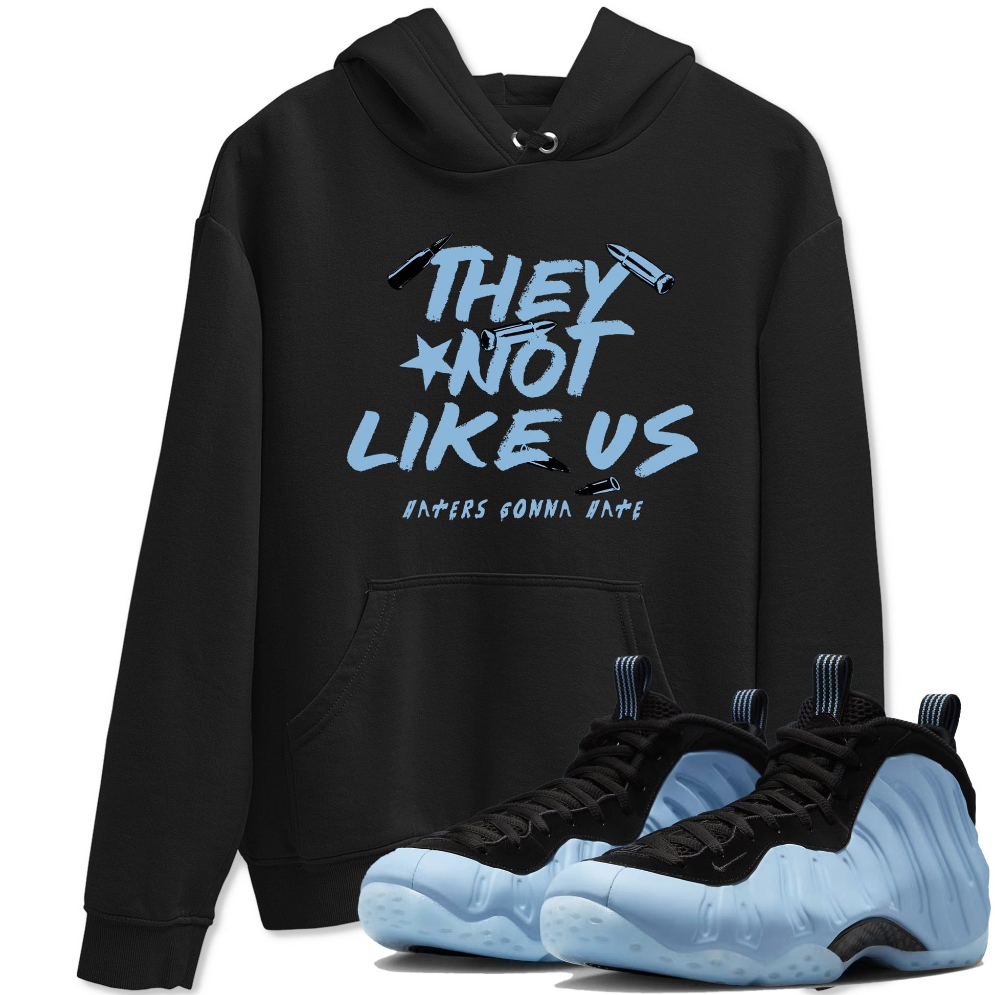 They Not Like Us sneaker match t-shirt styled to complete your fit with the Air Foamposite One Psychic Blue sneakers, shown in Black 1.