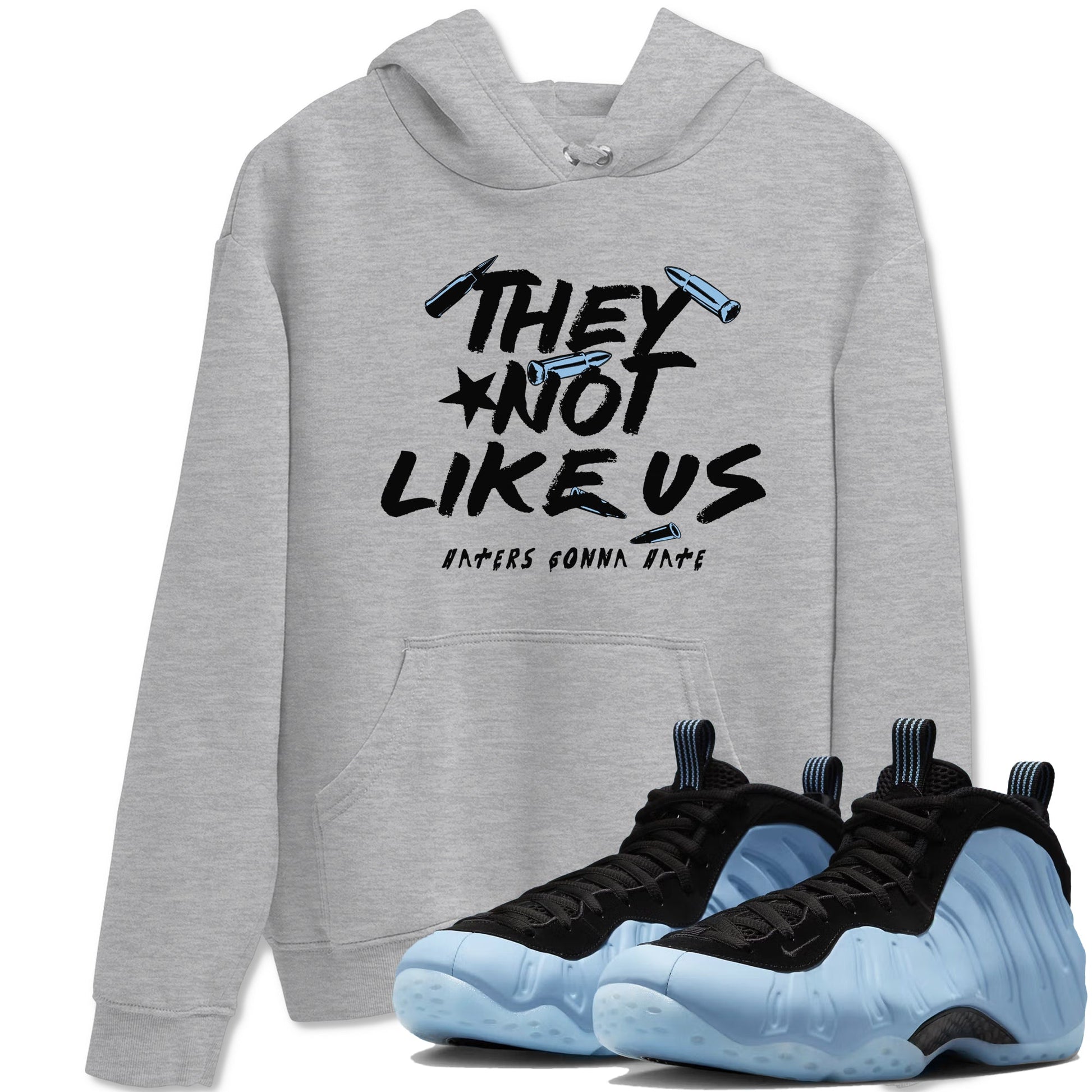 They Not Like Us sneaker match t-shirt styled to complete your fit with the Air Foamposite One Psychic Blue sneakers, shown in Heather Grey 1.