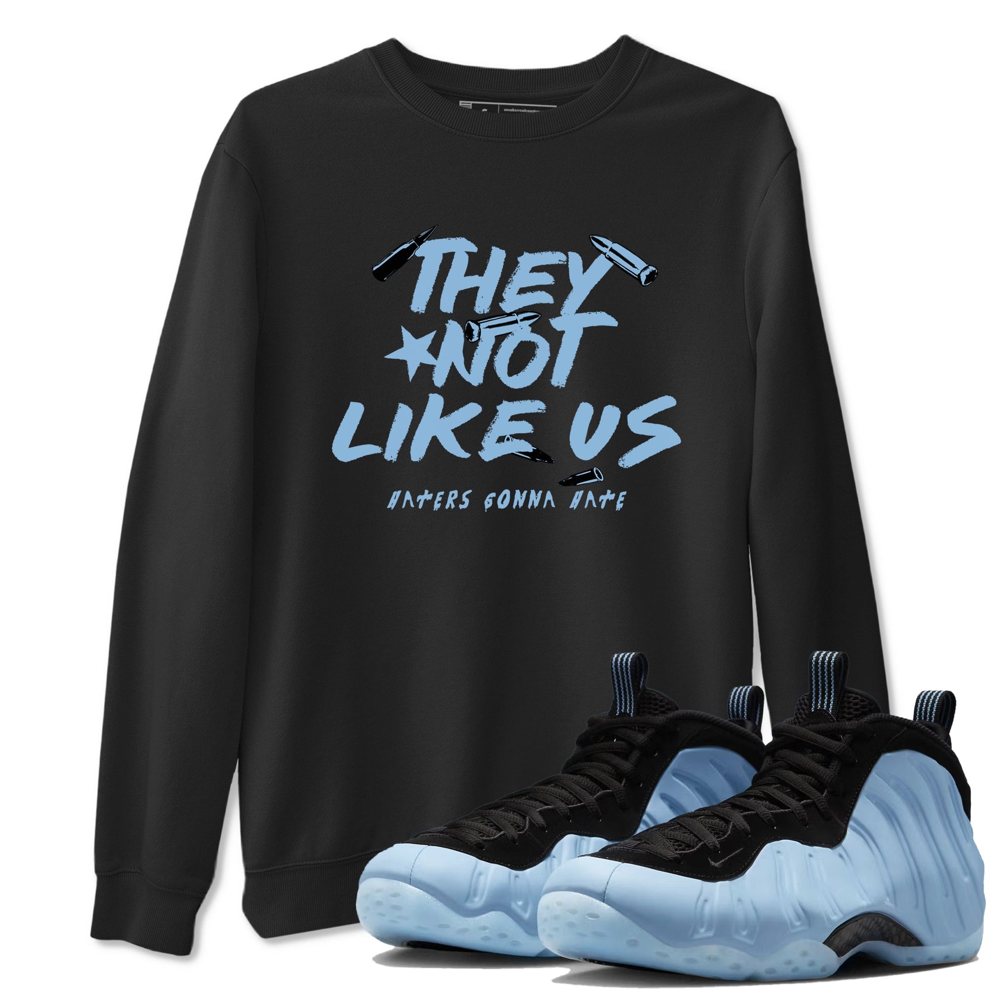 They Not Like Us sneaker match t-shirt styled to complete your fit with the Air Foamposite One Psychic Blue sneakers, shown in Black 1.