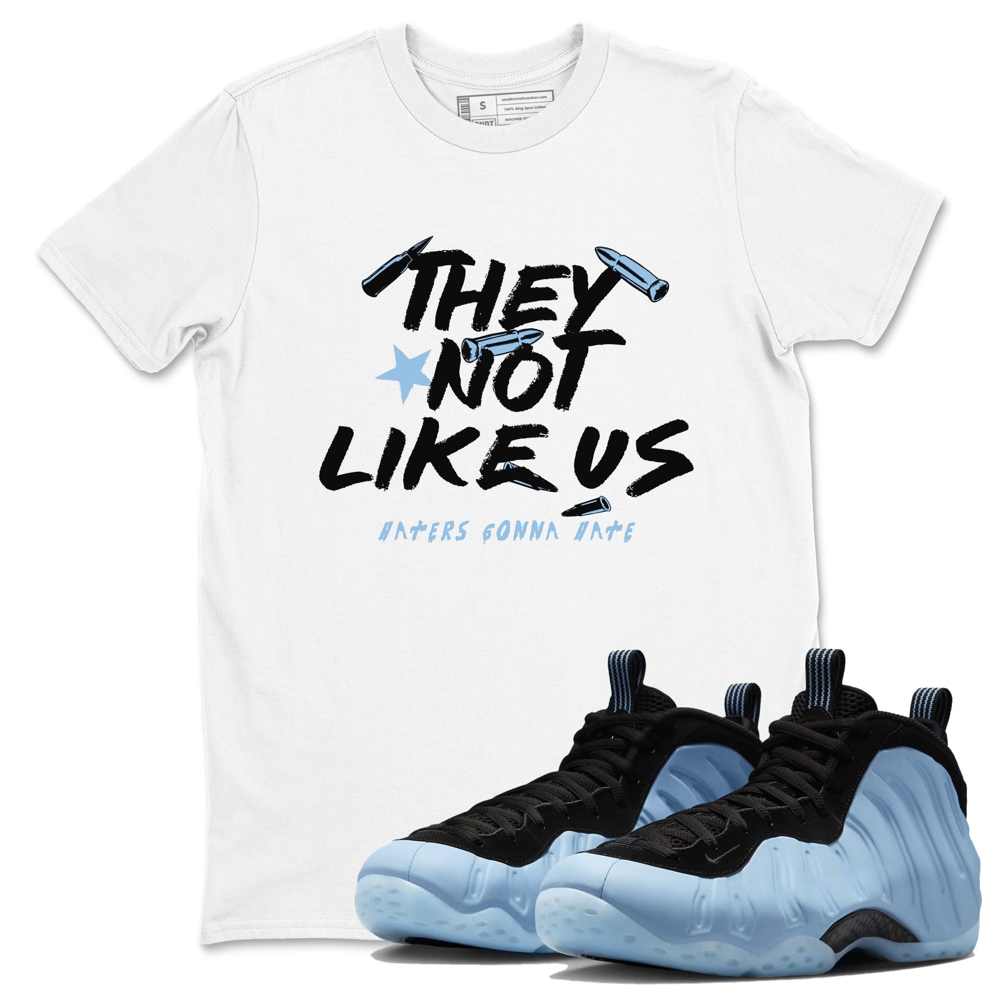 They Not Like Us sneaker match t-shirt styled to complete your fit with the Air Foamposite One Psychic Blue sneakers, shown in White 1.