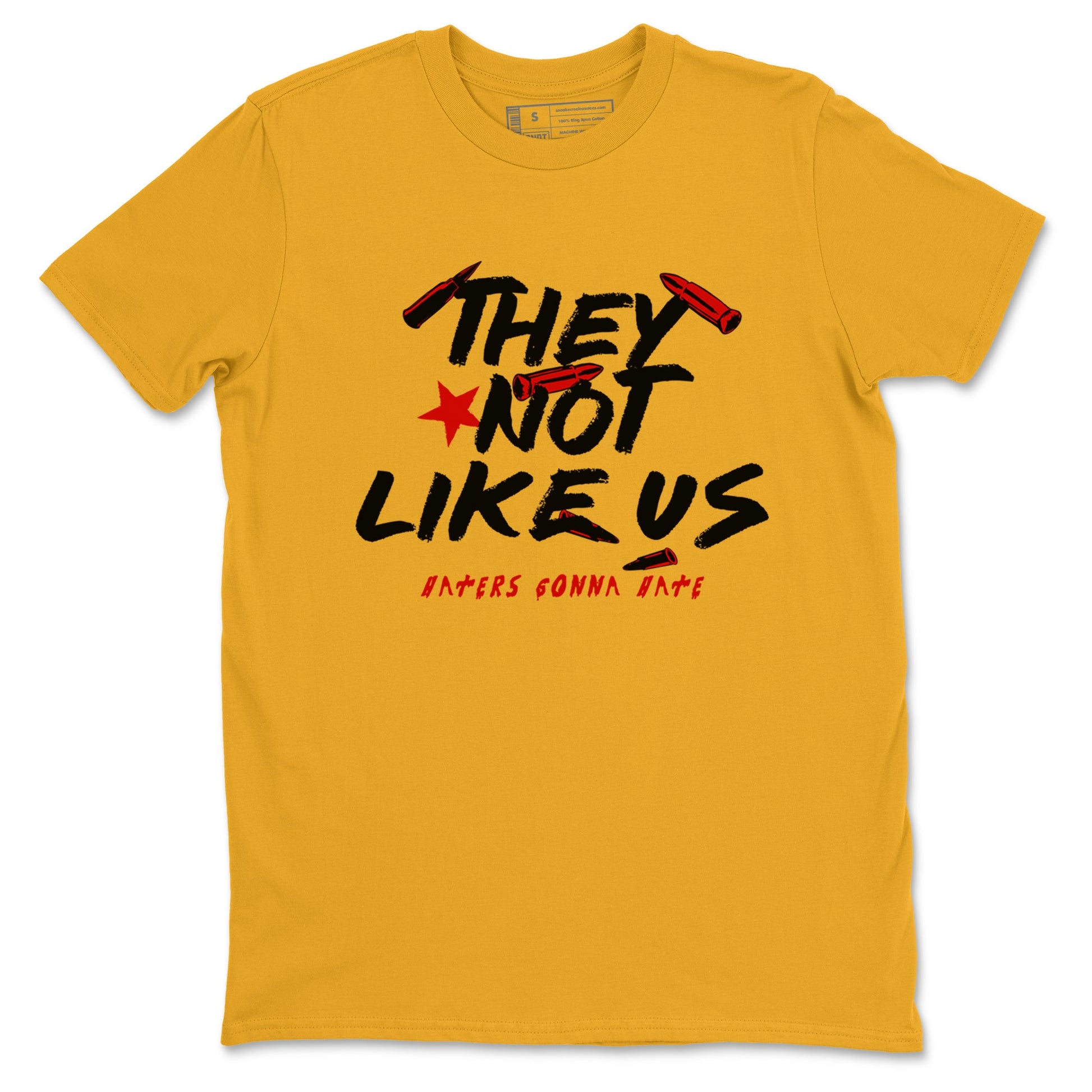 They Not Like Us sneaker match t-shirt styled to complete your fit with the Air Jordan 14 Challenge Red sneakers, AJ14 Ferrari, shown in Gold 2.