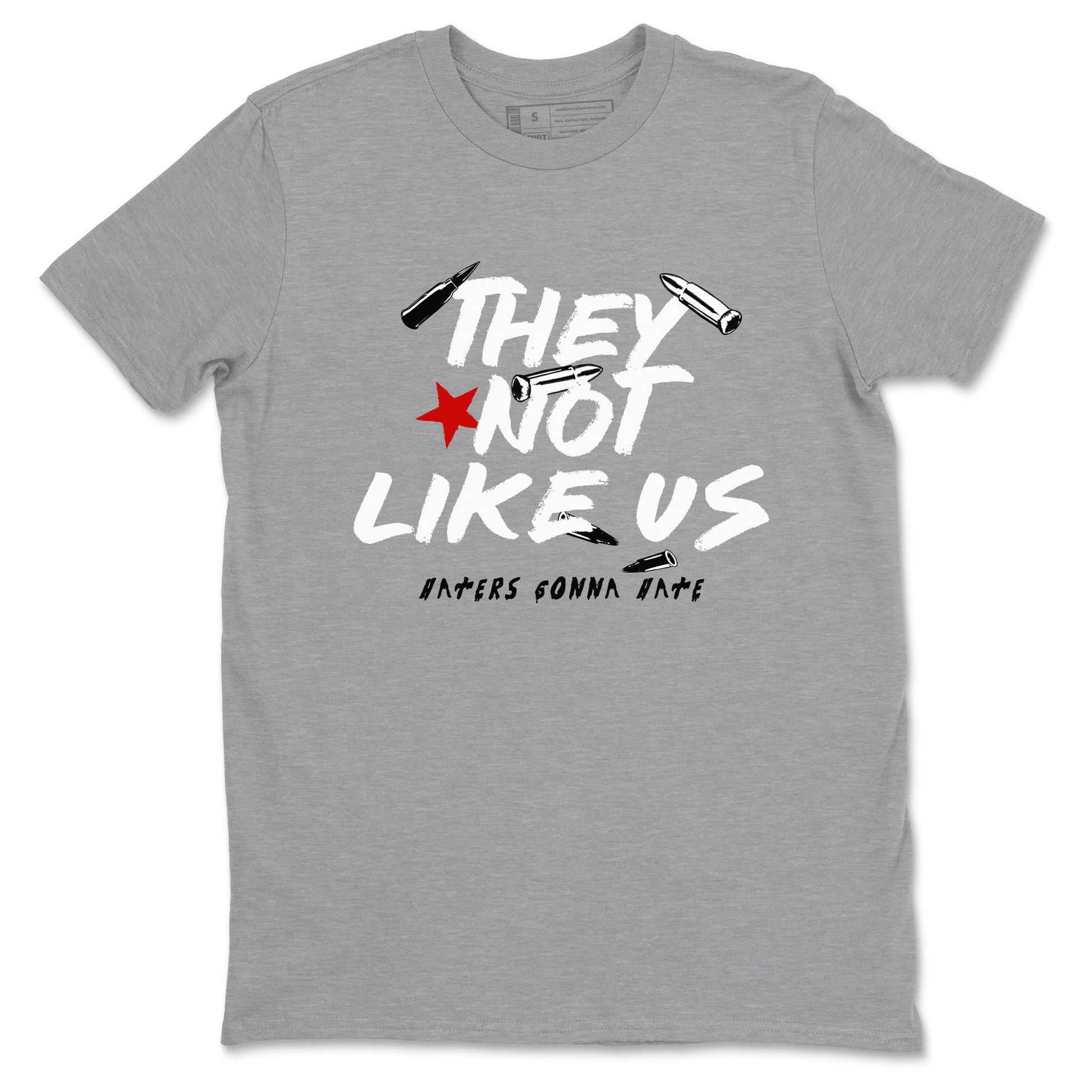 They Not Like Us sneaker match t-shirt styled to complete your fit with the Air Jordan 4 White Cement sneakers, shown in Heather Grey 2.