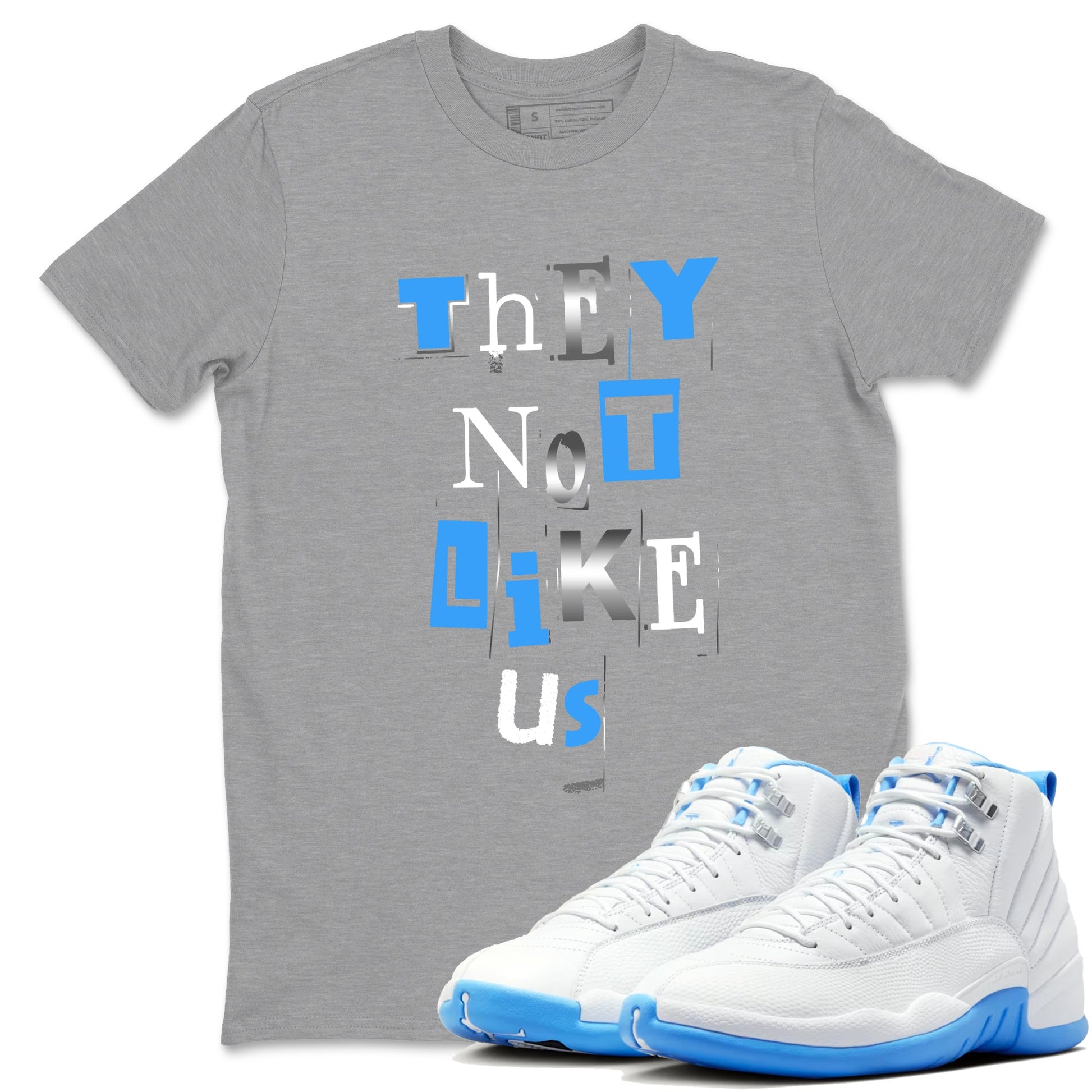 Vintage They Not Like Us sneaker match t-shirt styled to complete your fit with the Air Jordan 12 White and University Blue sneakers, shown in Heather Grey 1.