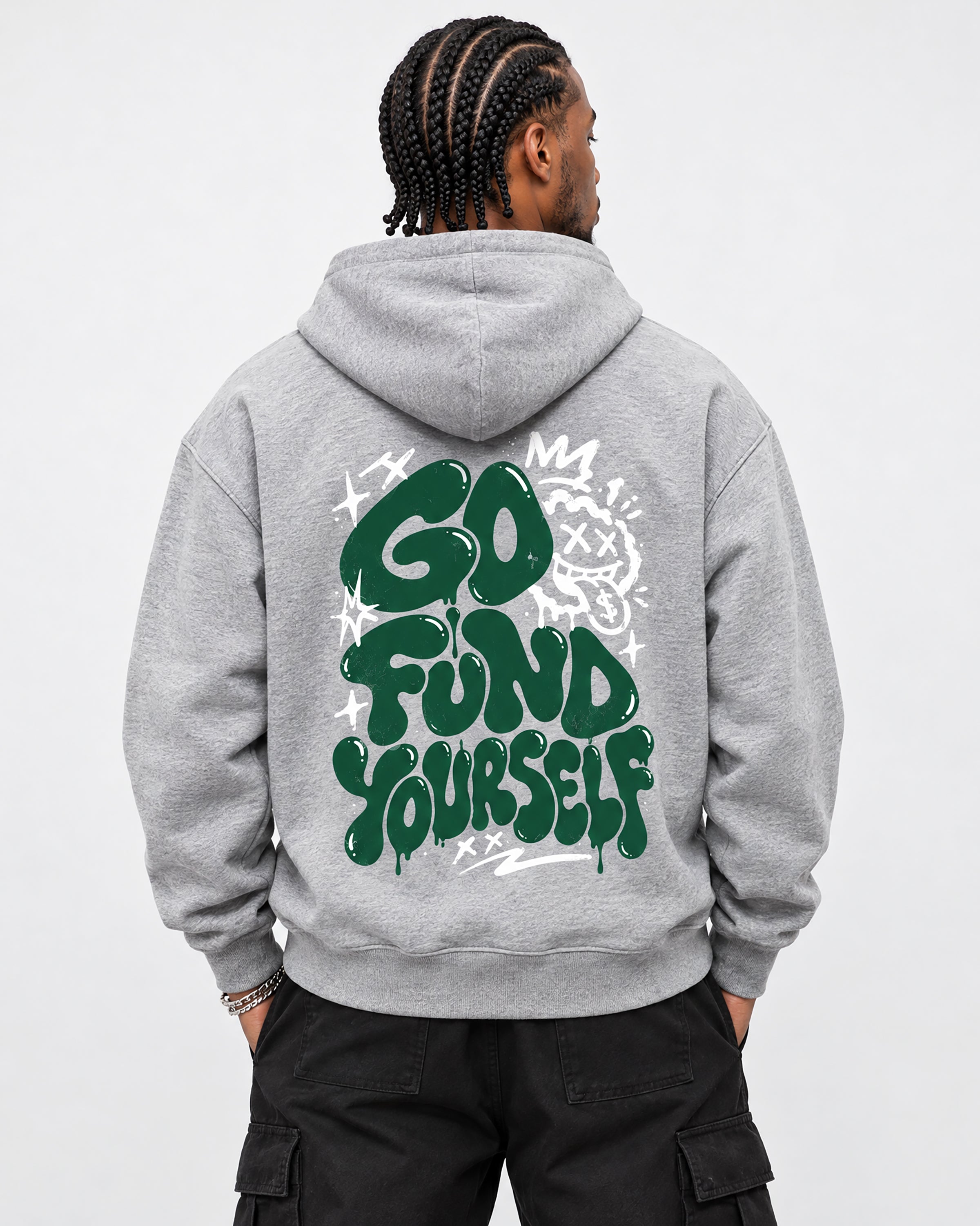 A man viewed from behind wearing a heather gray hoodie with a large green and white graphic on the back reading 'GO FUND YOURSELF', paired with black cargo pants against a light gray studio background.