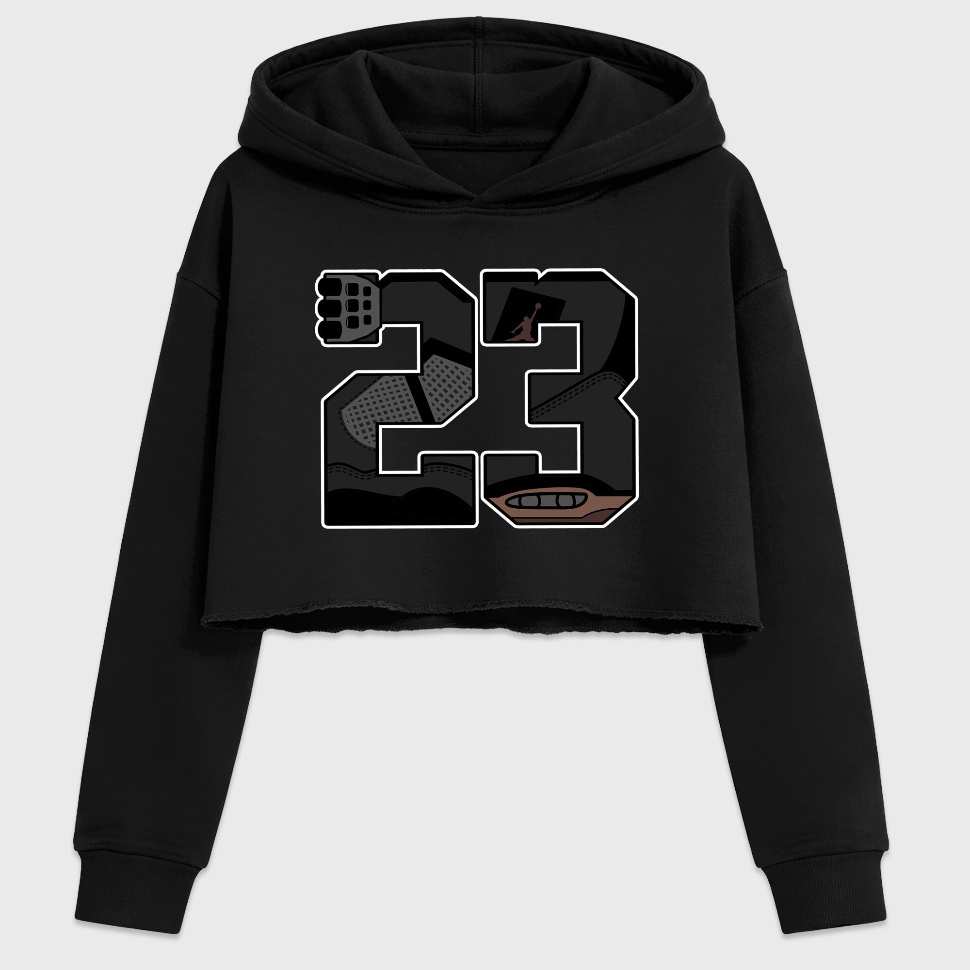 23 Women’s Graphic Crop Tee featuring original streetwear artwork designed to match the Air Jordan 4 London. Black 2 Crop Tee.
