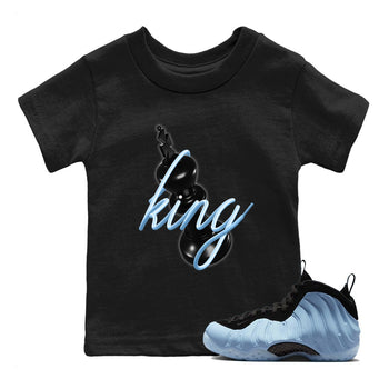 3D King baby and kids t-shirt crafted for little sneakerheads to shine with the Air Foamposite One Psychic Blue sneakers, displayed in Black 1.