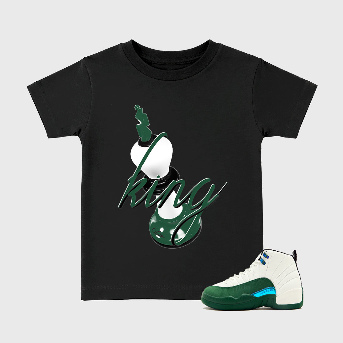 3D King Baby & Kids Graphic T-Shirt featuring original artwork designed to match the Air Jordan 12 Summit Green. Black 1 Kids Graphic Tee.