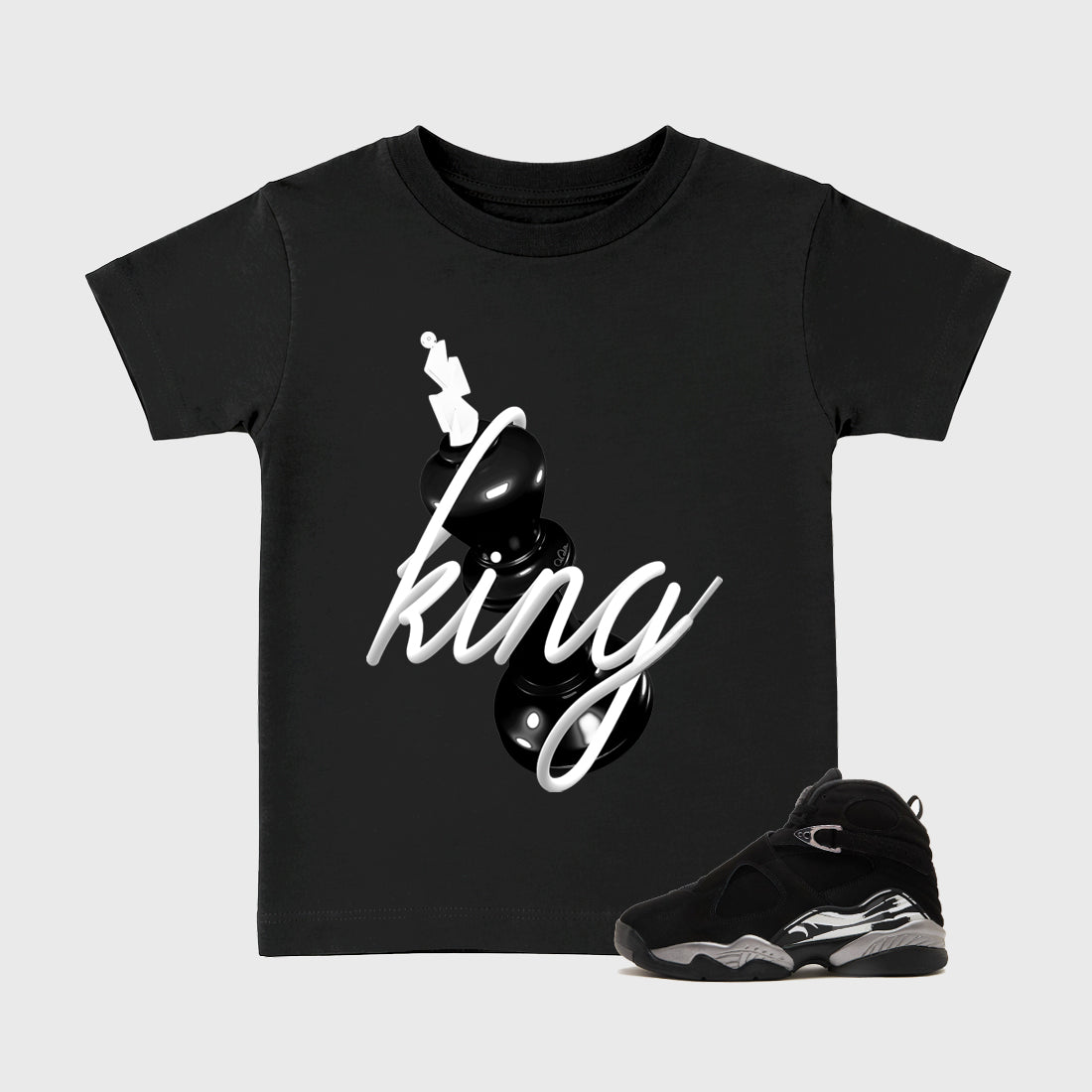 3D King Baby & Kids Graphic T-Shirt featuring original artwork designed to match the Air Jordan 8 Chrome. Black 1 Kids Graphic Tee.