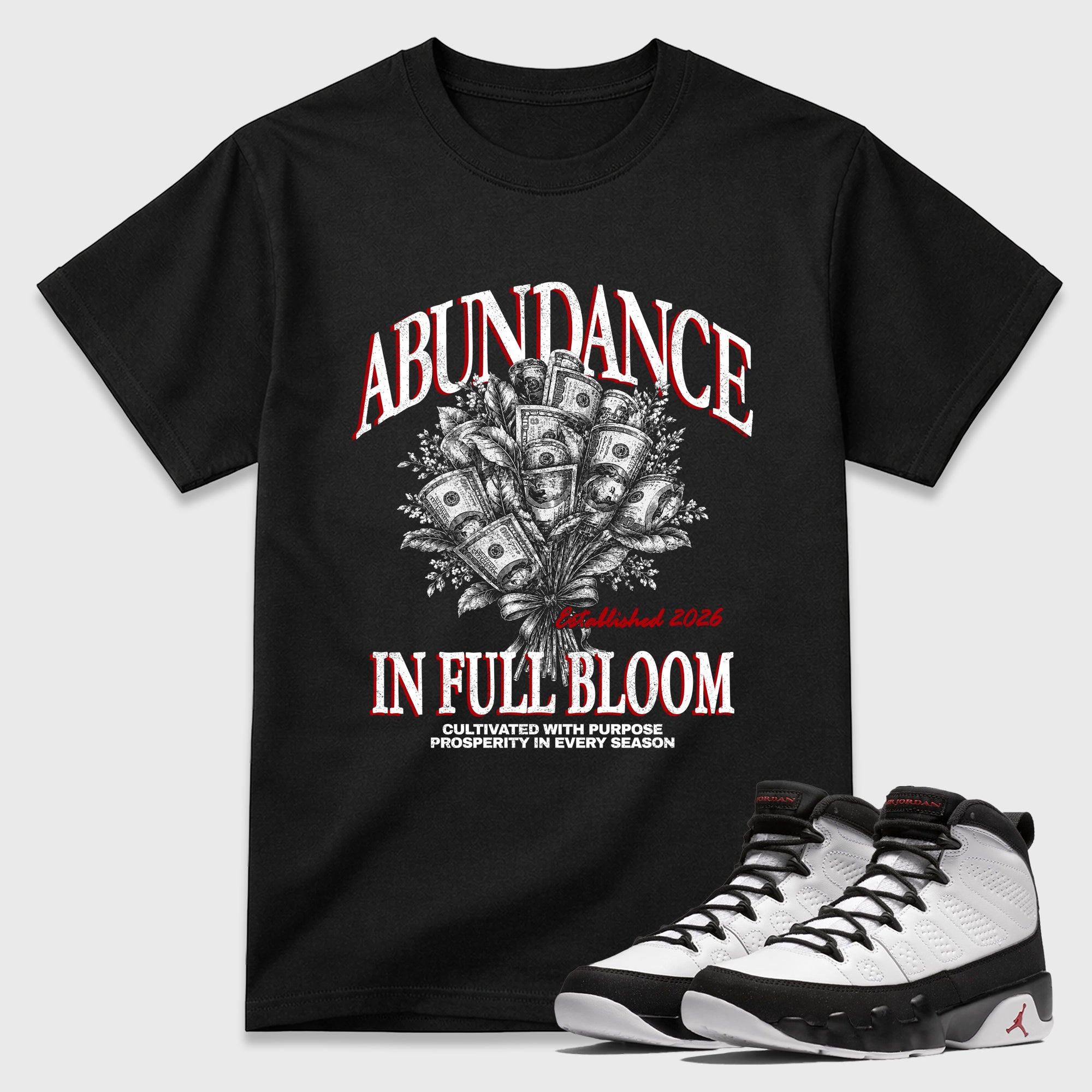 Abundance Graphic T-Shirt featuring original streetwear artwork designed to match the Air Jordan 9 True Red. Black 1 Graphic T-Shirt.
