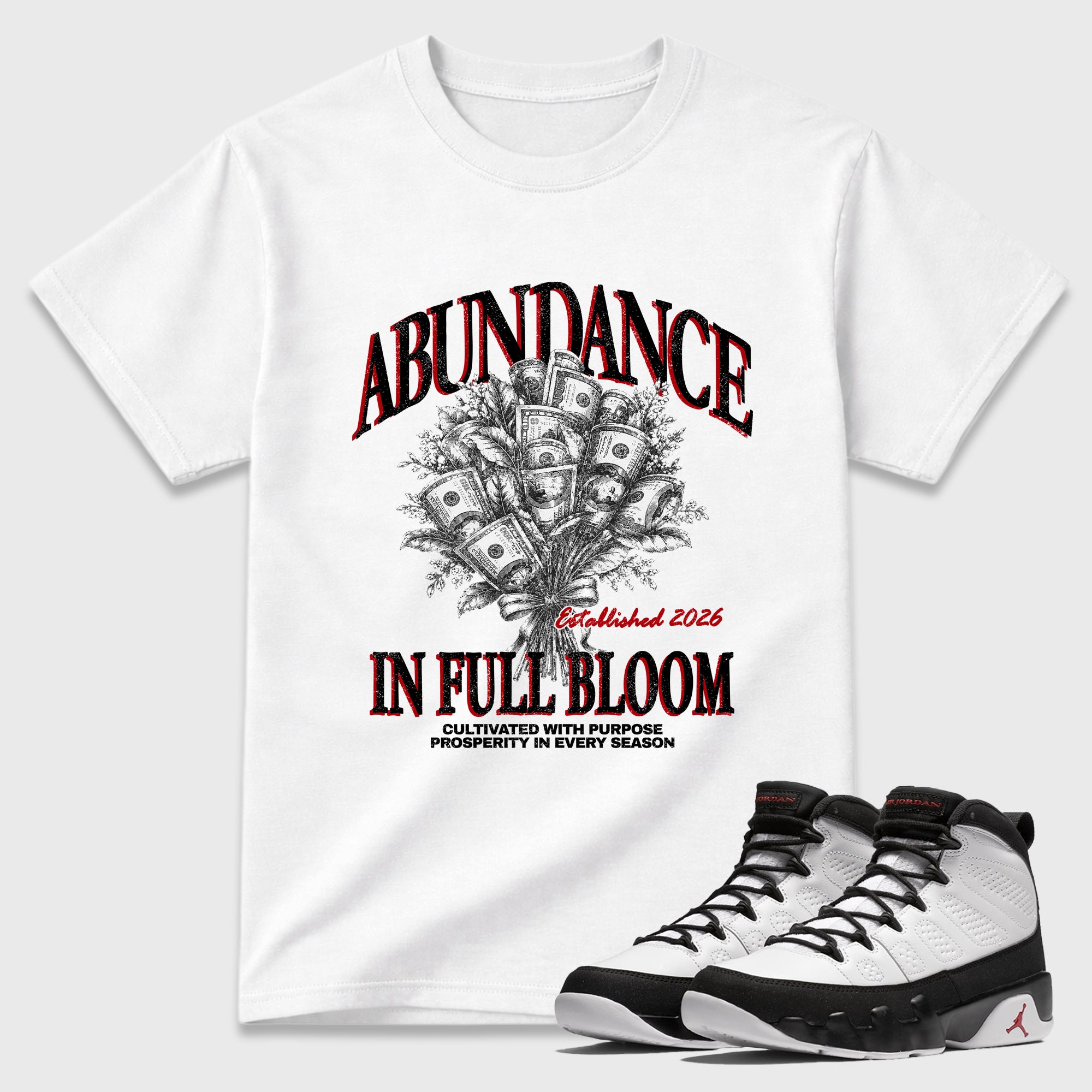 Abundance Graphic T-Shirt featuring original streetwear artwork designed to match the Air Jordan 9 True Red. White 1 Graphic T-Shirt.