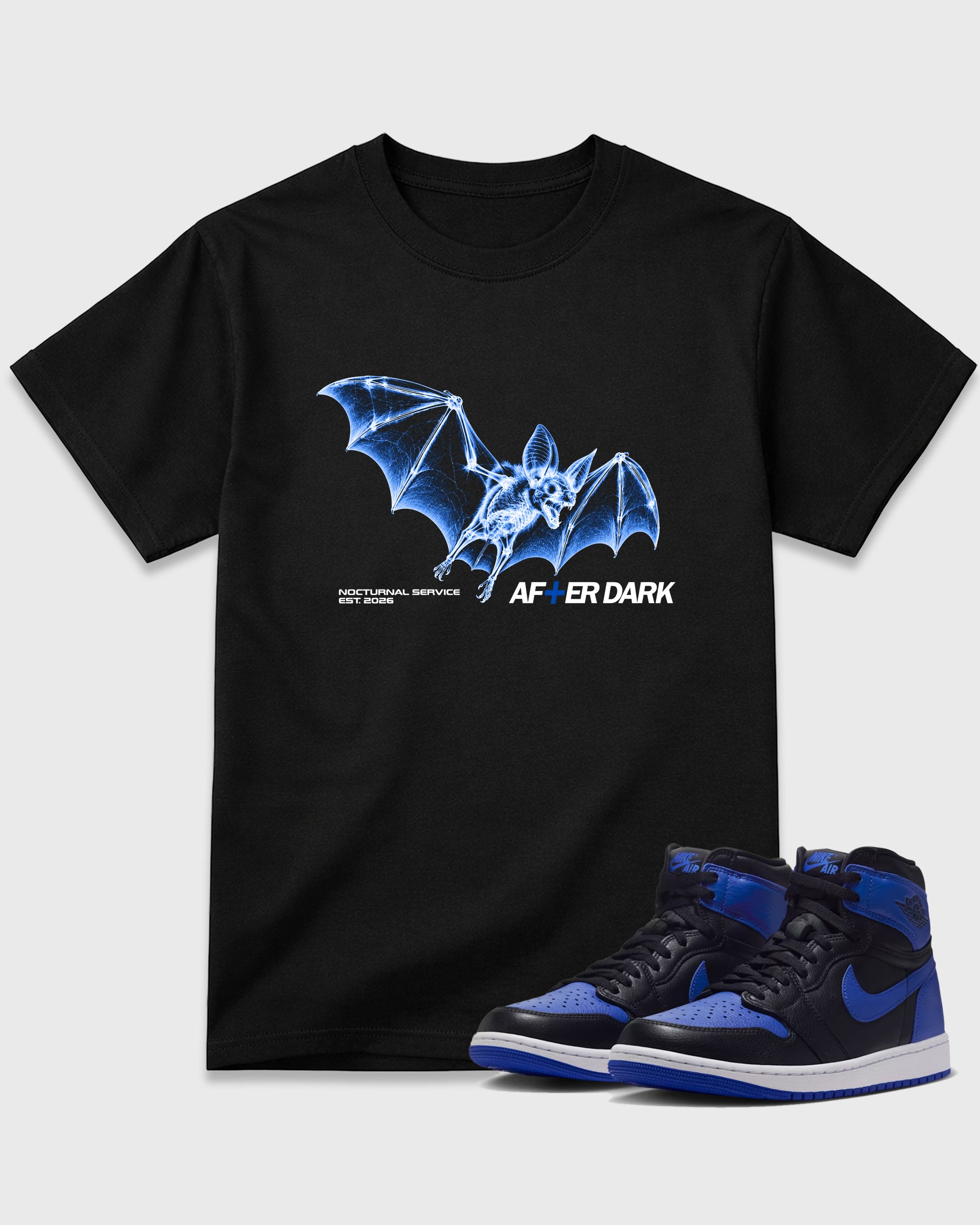 After Dark Graphic T-Shirt featuring original streetwear artwork designed to match the Air Jordan 1 Royal. Black 1 Graphic T-Shirt.
