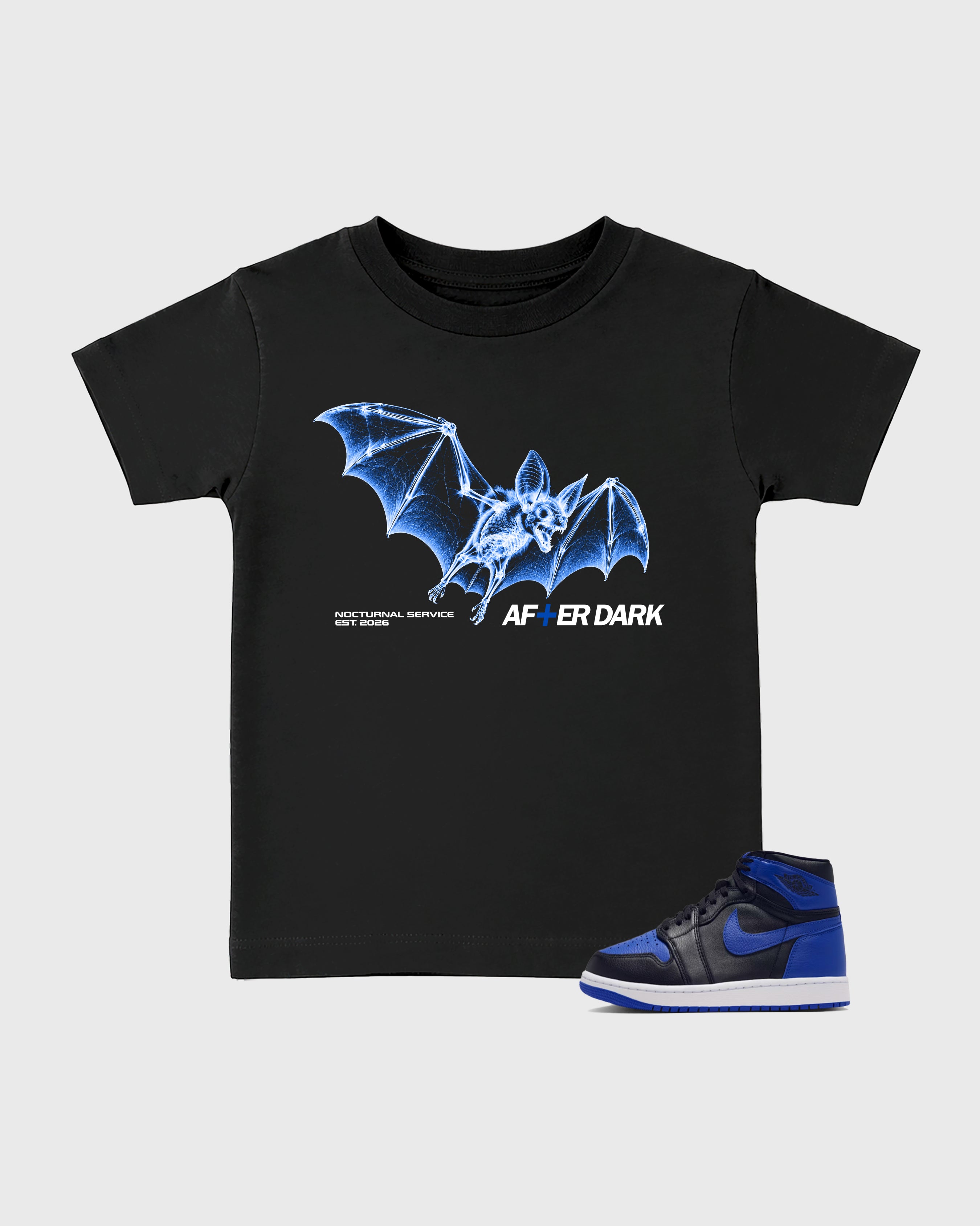 After Dark Baby & Kids Graphic T-Shirt featuring original artwork designed to match the Air Jordan 1 Royal. Black 1 Kids Graphic Tee.