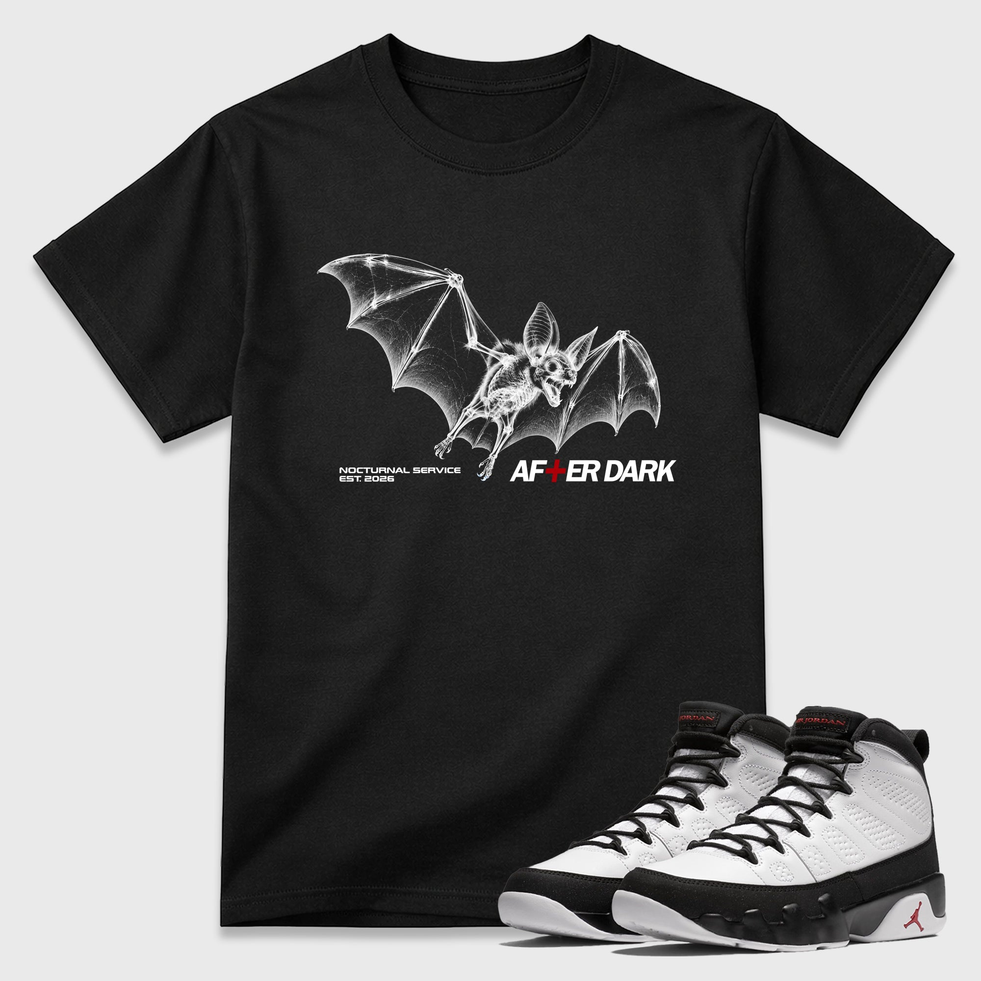 After Dark Graphic T-Shirt featuring original streetwear artwork designed to match the Air Jordan 9 True Red. Black 1 Graphic T-Shirt.