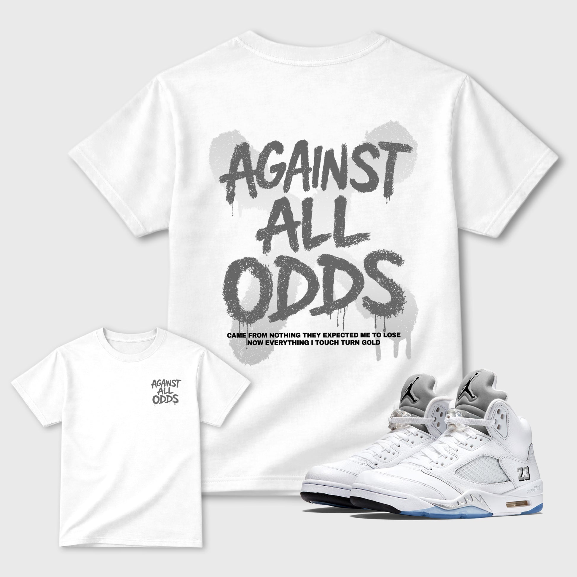 Against All Oddsgraphic t-shirt. Streetwear sneakerfit. Sneaker outfit. Complete your fit with the Air Jordan 5 White Metallic sneakers, shown in White.