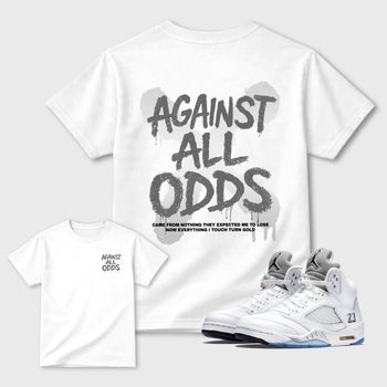 Against All Oddsgraphic t-shirt. Streetwear sneakerfit. Sneaker outfit. Complete your fit with the Air Jordan 5 White Metallic sneakers, shown in White.