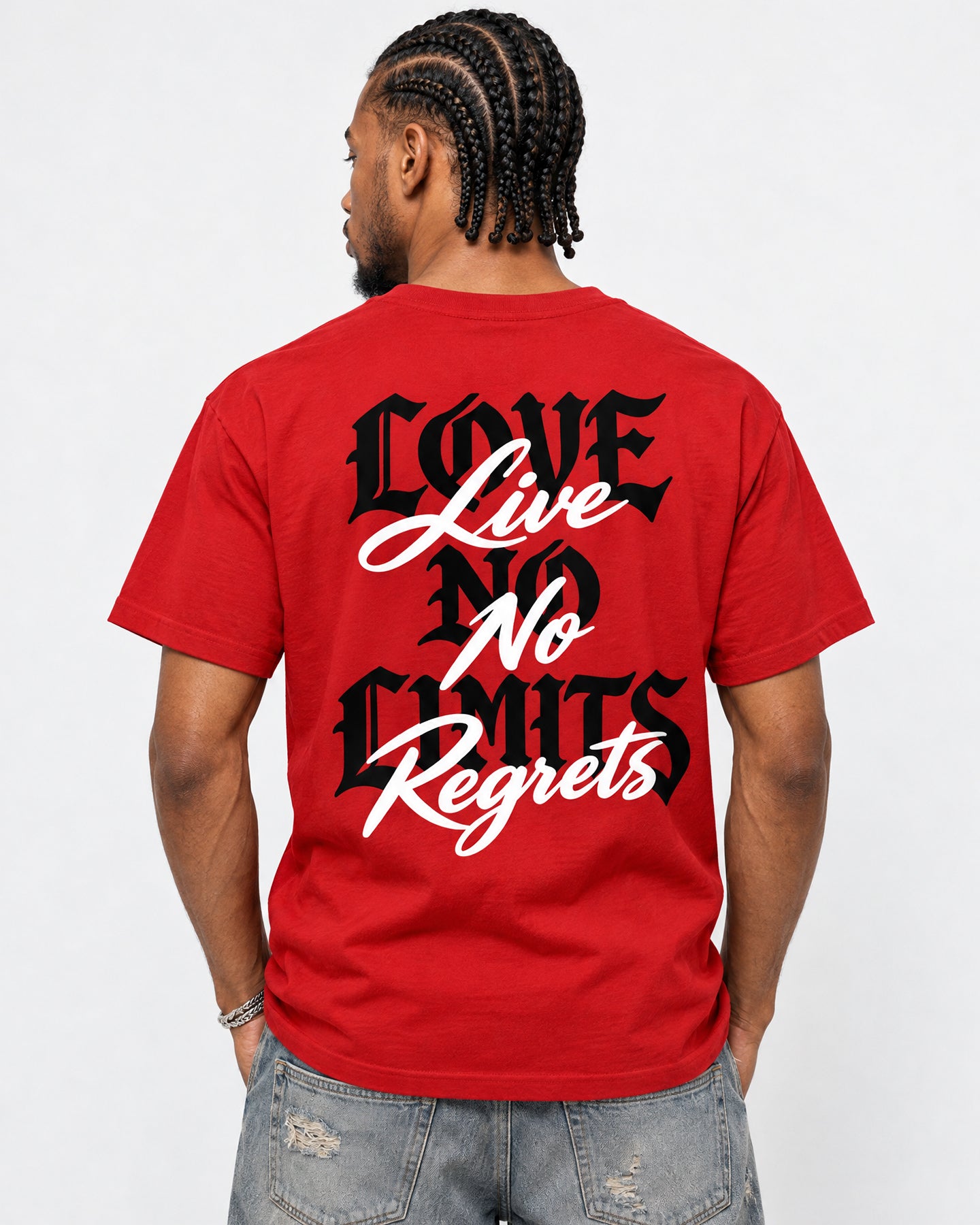 A man viewed from behind wearing a bright red t-shirt with a black and white graphic text design that reads 'LOVE Live No Regrets'.