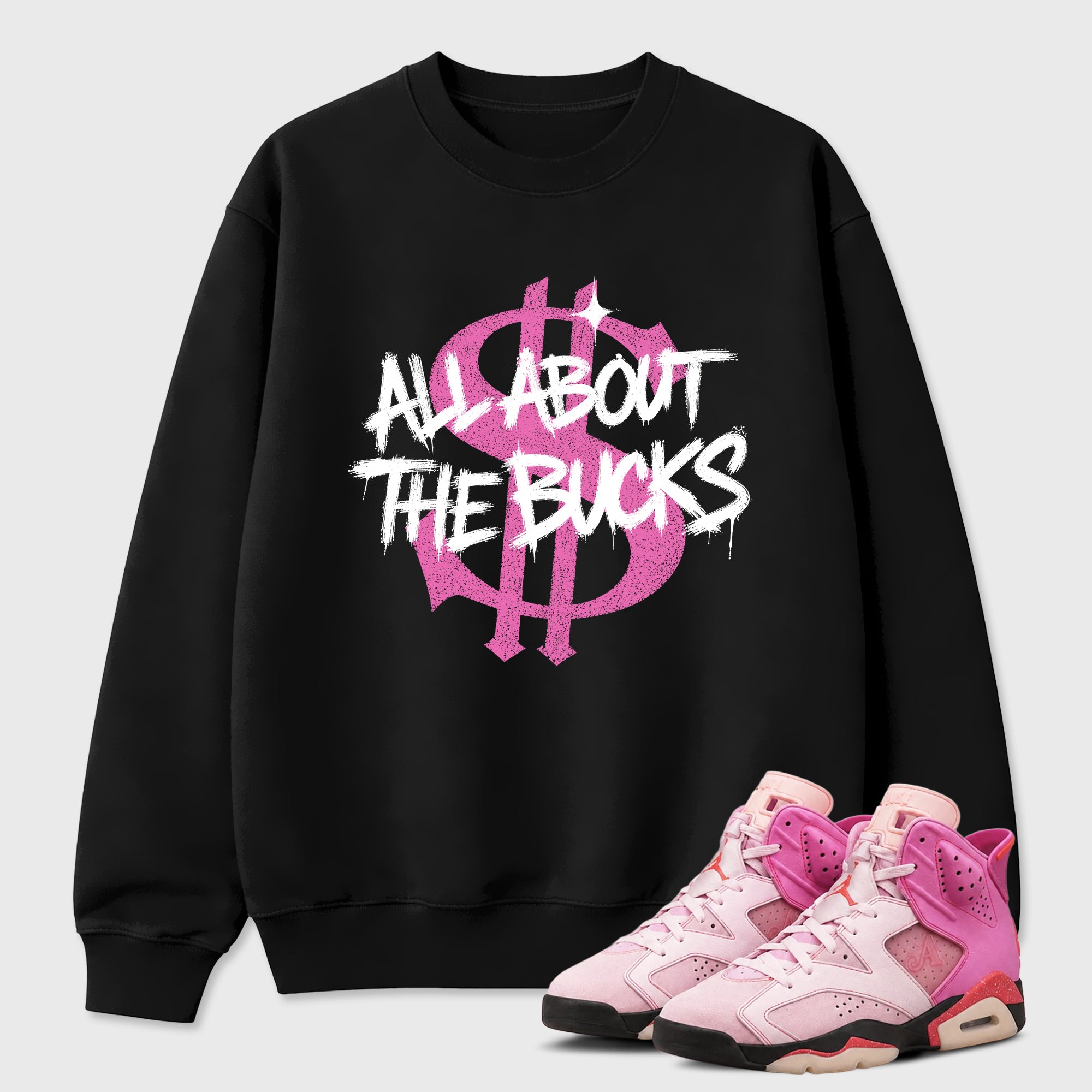 All About the Bucks Graphic T-Shirt featuring original streetwear artwork designed to match the Air Jordan 6 Playful Pink. Black 1 Graphic Tee.