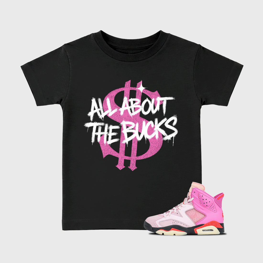 All About the Bucks Baby & Kids Graphic T-Shirt featuring original artwork designed to match the Air Jordan 6 Playful Pink. Black 1 Kids Graphic Tee.