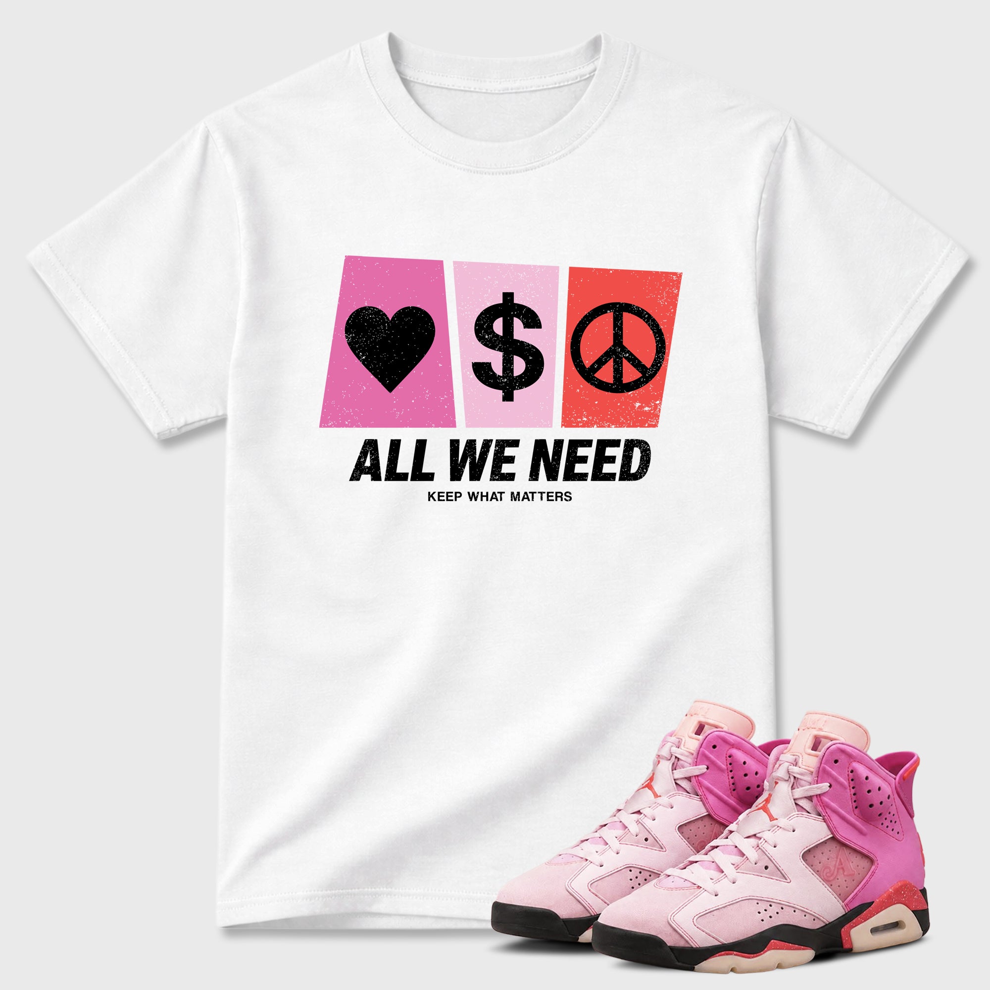 All We Need Graphic T-Shirt featuring original streetwear artwork designed to match the Air Jordan 6 Playful Pink. White 1 Graphic T-Shirt.