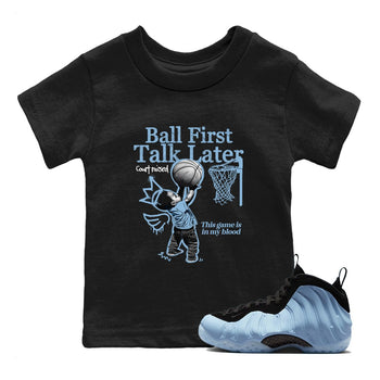 Ball First Talk Later baby and kids t-shirt crafted for little sneakerheads to shine with the Air Foamposite One Psychic Blue sneakers, displayed in Black 1.