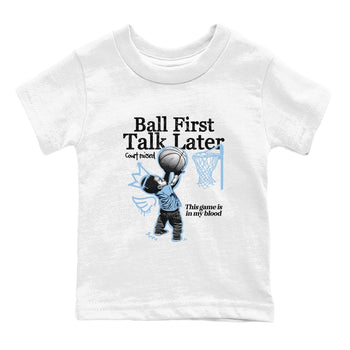 Ball First Talk Later baby and kids t-shirt crafted for little sneakerheads to shine with the Air Foamposite One Psychic Blue sneakers, displayed in White 2.