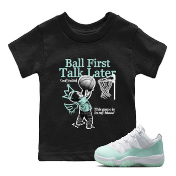 Ball First Talk Later baby and kids t-shirt crafted for little sneakerheads to shine with the Air Jordan 11 Igloo sneakers, displayed in Black 1.