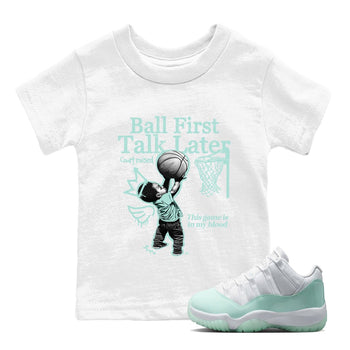 Ball First Talk Later baby and kids t-shirt crafted for little sneakerheads to shine with the Air Jordan 11 Igloo sneakers, displayed in White 1.