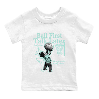 Ball First Talk Later baby and kids t-shirt crafted for little sneakerheads to shine with the Air Jordan 11 Igloo sneakers, displayed in White 2.