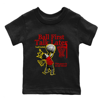 Ball First Talk Later baby and kids t-shirt crafted for little sneakerheads to shine with the Air Jordan 14 Challenge Red sneakers, AJ14 Ferrari,  displayed in Black 2.