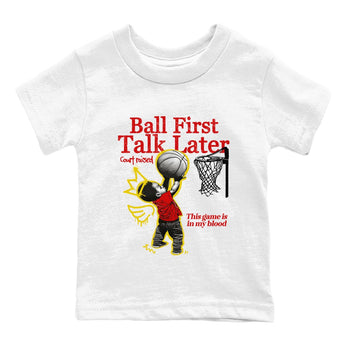 Ball First Talk Later baby and kids t-shirt crafted for little sneakerheads to shine with the Air Jordan 14 Challenge Red sneakers, AJ14 Ferrari,  displayed in White 2.