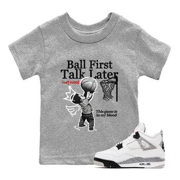 Ball First Talk Later baby and kids t-shirt crafted for little sneakerheads to shine with the Air Jordan 4 White Cement sneakers, displayed in Heather Grey 1.