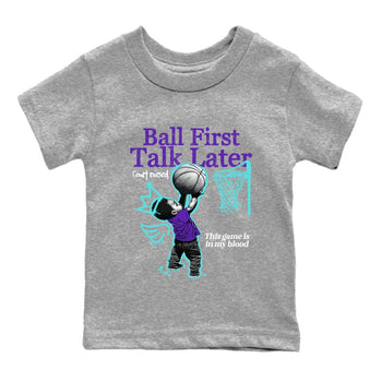 Ball First Talk Later baby and kids t-shirt crafted for little sneakerheads to shine with the Air Jordan 5 Grape sneakers, displayed in Heather Grey 2.