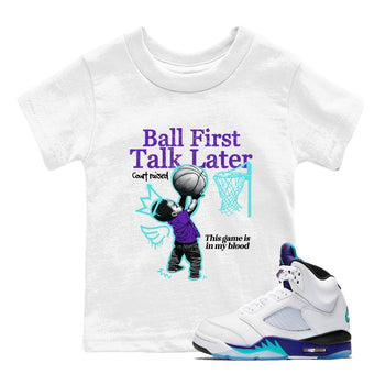 Ball First Talk Later baby and kids t-shirt crafted for little sneakerheads to shine with the Air Jordan 5 Grape sneakers, displayed in White 1.