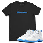 Born Different sneaker match t-shirt styled to complete your fit with the Air Jordan 12 White and University Blue sneakers, shown in Black 1.