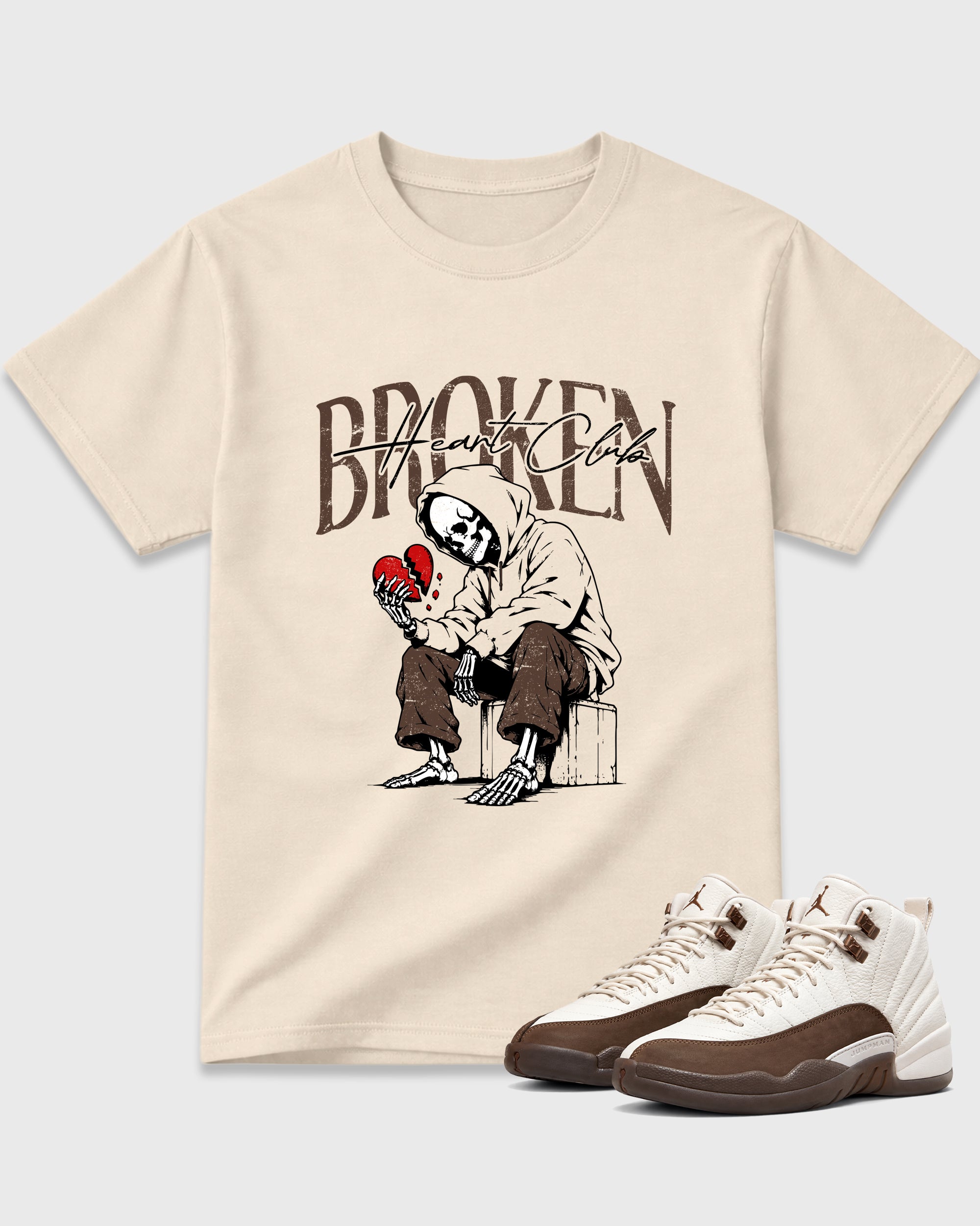 Broken Heart Club Graphic T-Shirt featuring original streetwear artwork designed to match the Air Jordan 12 Fireside. Natural 1 Graphic T-Shirt.