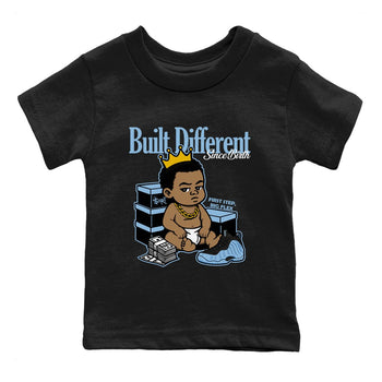 Built Different Since Birth baby and kids t-shirt crafted for little sneakerheads to shine with the Air Foamposite One Psychic Blue sneakers, displayed in Black 2.