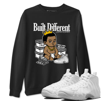 Built Different Since Birth sneaker match t-shirt styled to complete your fit with the Air Foamposite One Triple White sneakers, shown in Black 1.