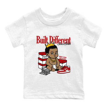 Built Different Since Birth baby and kids t-shirt crafted for little sneakerheads to shine with the Air Force 1 University Red sneakers, displayed in White 2.