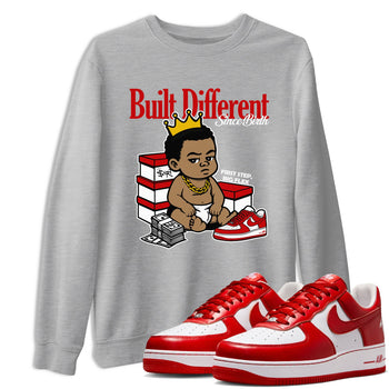 Built Different Since Birth sneaker match t-shirt styled to complete your fit with the Air Force 1 University Red sneakers, shown in Heather Grey 1.