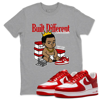 Built Different Since Birth sneaker match t-shirt styled to complete your fit with the Air Force 1 University Red sneakers, shown in Heather Grey 1.