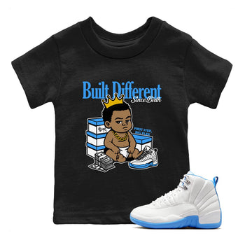 Built Different Since Birth baby and kids t-shirt crafted for little sneakerheads to shine with the Air Jordan 12 White and University Blue sneakers, displayed in Black 1.