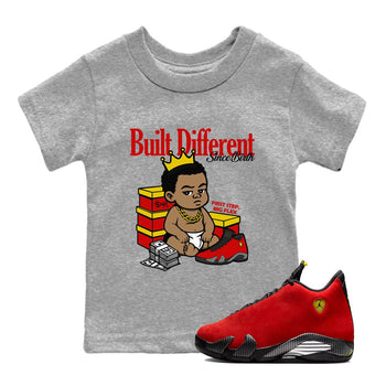 Built Different Since Birth baby and kids t-shirt crafted for little sneakerheads to shine with the Air Jordan 14 Challenge Red sneakers, AJ14 Ferrari,  displayed in Heather Grey 1.