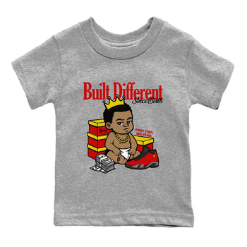 Built Different Since Birth baby and kids t-shirt crafted for little sneakerheads to shine with the Air Jordan 14 Challenge Red sneakers, AJ14 Ferrari,  displayed in Heather Grey 2.