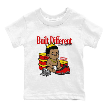 Built Different Since Birth baby and kids t-shirt crafted for little sneakerheads to shine with the Air Jordan 14 Challenge Red sneakers, AJ14 Ferrari,  displayed in White 2.