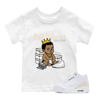 Built Different Since Birth baby and kids t-shirt crafted for little sneakerheads to shine with the Air Jordan 3 Pure Money sneakers, displayed in White 1.