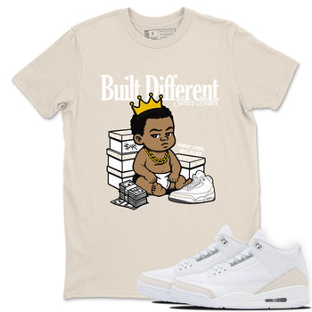 Built Different Since Birth sneaker match t-shirt styled to complete your fit with the Air Jordan 3 Pure Money sneakers, shown in Natural 1.