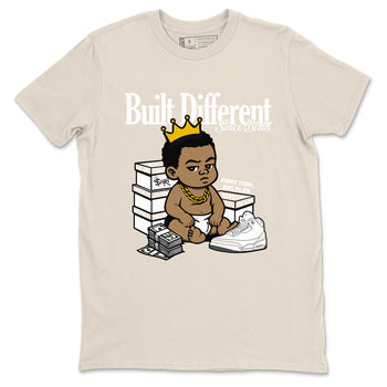 Built Different Since Birth sneaker match t-shirt styled to complete your fit with the Air Jordan 3 Pure Money sneakers, shown in Natural 2.