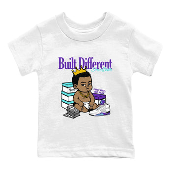 Built Different Since Birth baby and kids t-shirt crafted for little sneakerheads to shine with the Air Jordan 5 Grape sneakers, displayed in White 2.